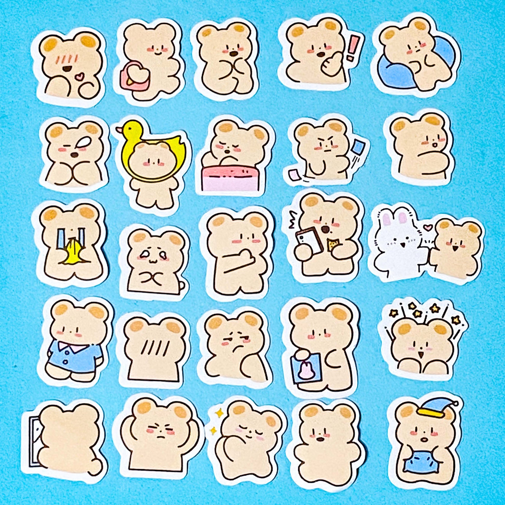 Collection of 50 glossy cartoon bear stickers on a blue background