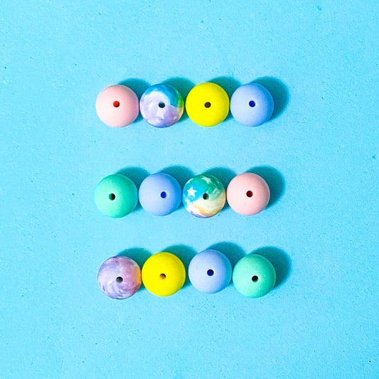 starry ombre pastel round 16mm silicone beads mixed set of 10 on a blue background