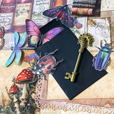 scrapbooking starter bundle with sepia scrapbook papers, vellum, vintage books bookmark, envelopes, card insect stickers, writing paper, textured papers and mini bottle. uk ephemera.