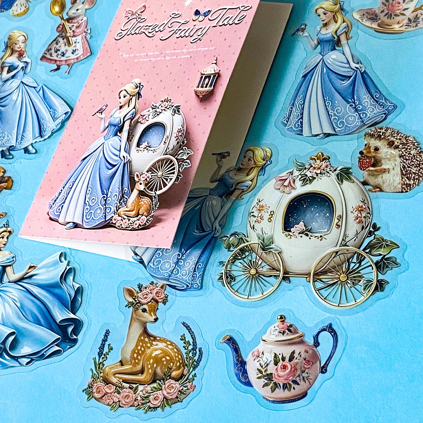 cinderella princess themed clear PET stickers pack of 30 with a glazed pottery glossy finish. Designs include cake, mouse, squirrel, deer, hedgehog and carriage. 