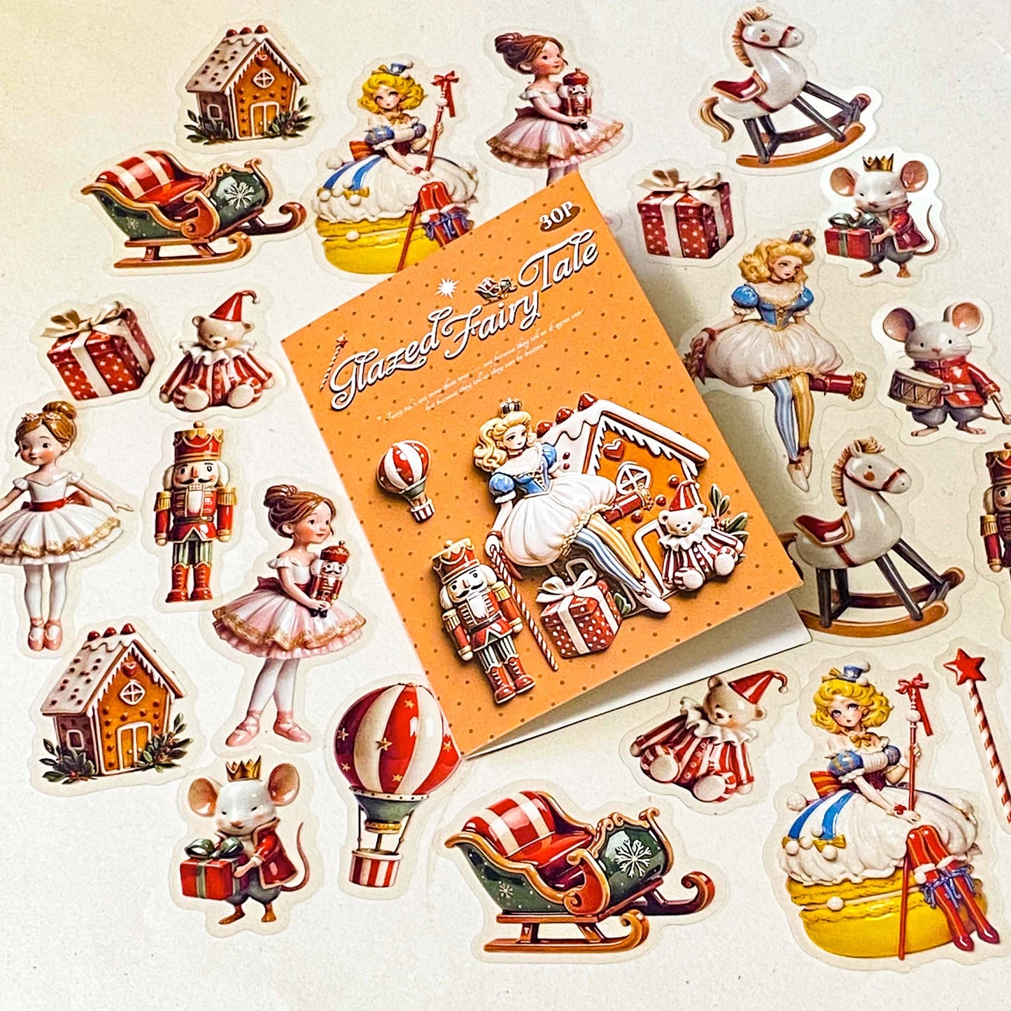 clara and the nutcracker suite clear PET large stickers with designs of toys including hot air balloon, doll, toy soldier, bear, rocking horse and mouse. Glazed effect so look like porcelain and glossy finish.
