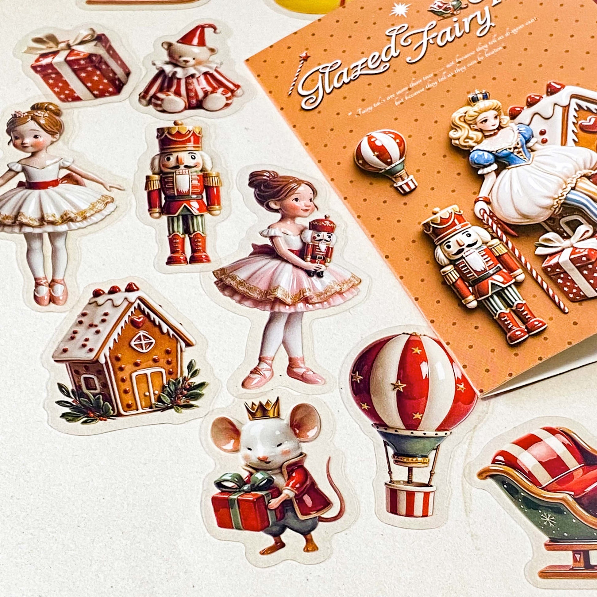 clara and the nutcracker suite clear PET large stickers with designs of toys including hot air balloon, doll, toy soldier, bear, rocking horse and mouse. Glazed effect so look like porcelain and glossy finish.