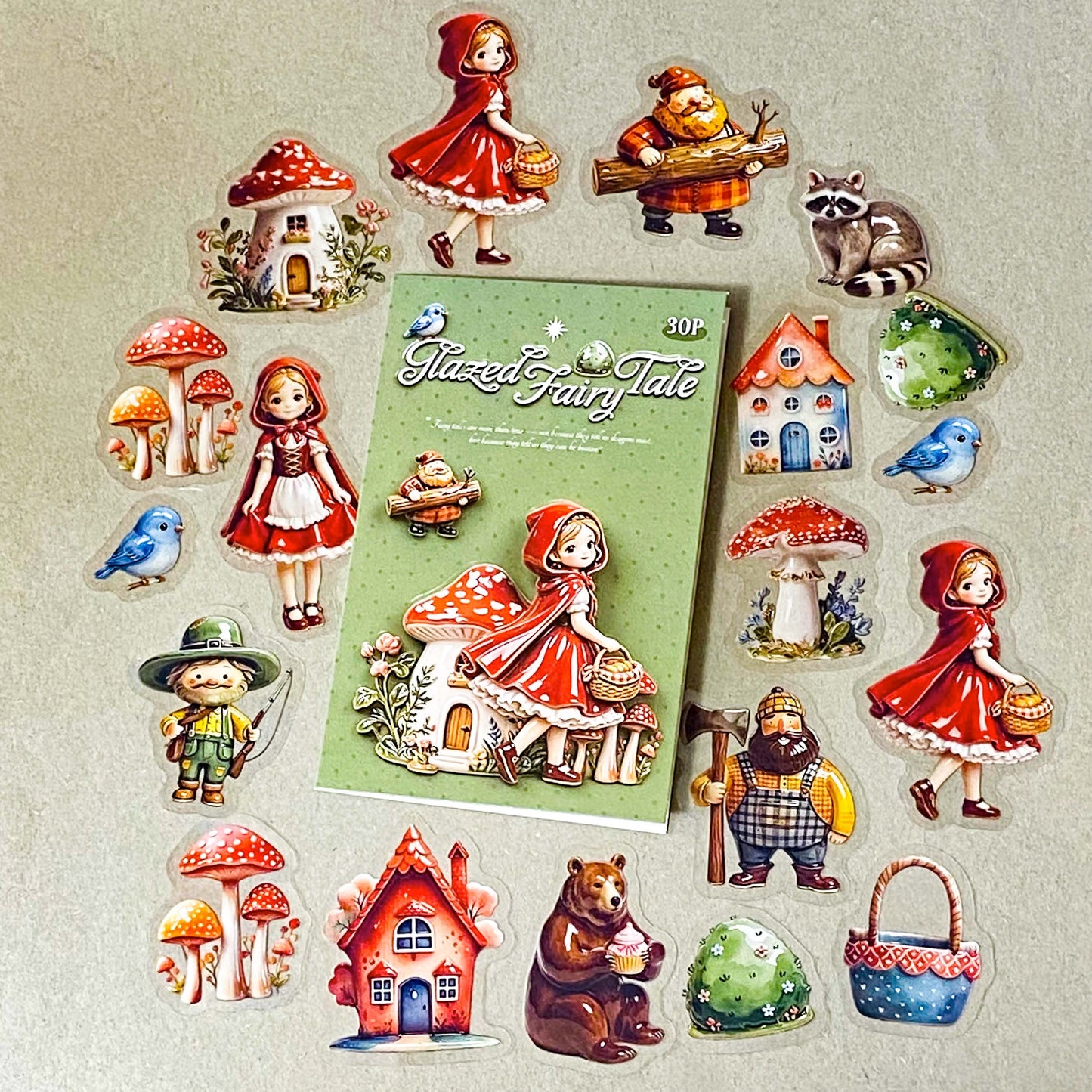 little red riding hood ceramic glazed clear PET sticker set of 30 designs including girl, cottage, mushrooms, basket, raccoon, brown bear, blue bird and woodcutter. Uk cute stationery shop.