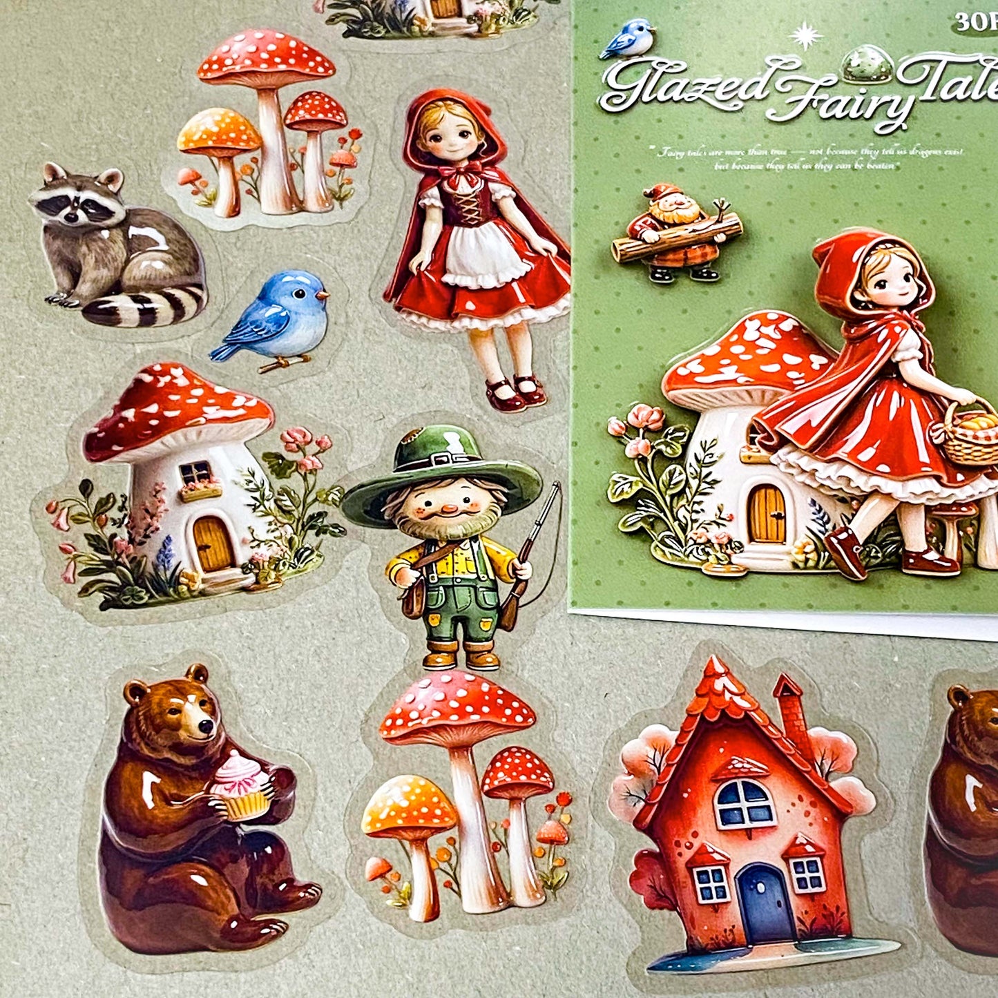 little red riding hood ceramic glazed clear PET sticker set of 30 designs including girl, cottage, mushrooms, basket, raccoon, brown bear, blue bird and woodcutter. Uk cute stationery shop.