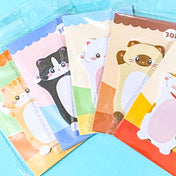 cat sticky memo pads on a blue background