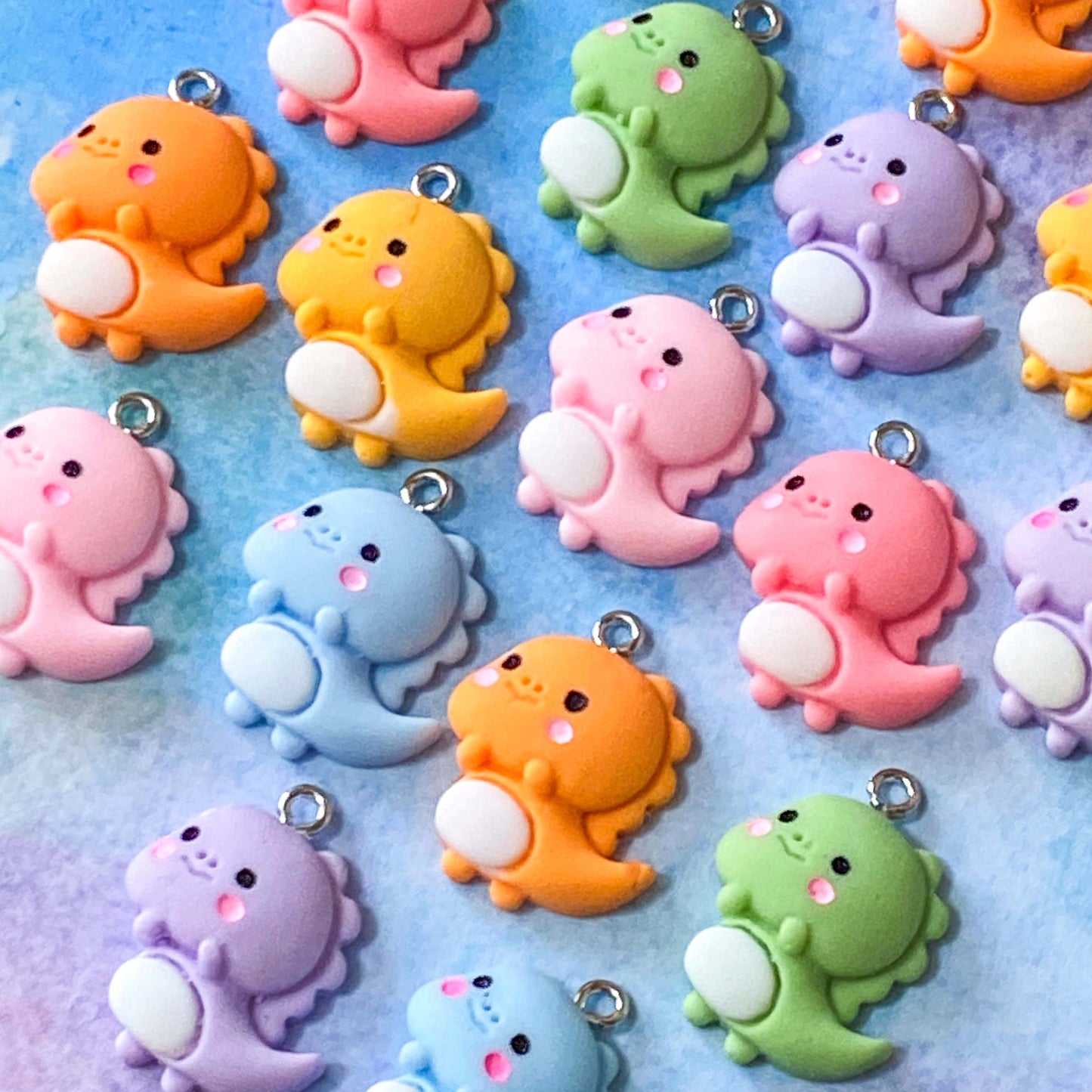 baby cute kawaii dino dinos dinosaur dinosaurs charm charms resin pendant uk craft supplies shop store pretty fun jewellery making lilac pink orange green yellow