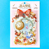 large alice inspired falling into wonderland sticker set with oversized now globe scene card, transparent PET stickers, pocket watch, roses and playing cards details on pink backing card with bow