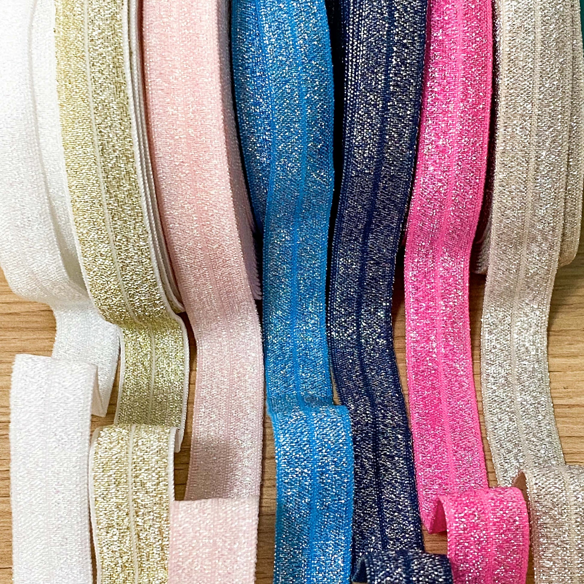 fold over elastic elastics ribbon ribbons glitter glittery foil foiled sparkly pretty craft supplies shop store crafts yard pink blue navy lilac gold silver white peach black pink  Edit alt text