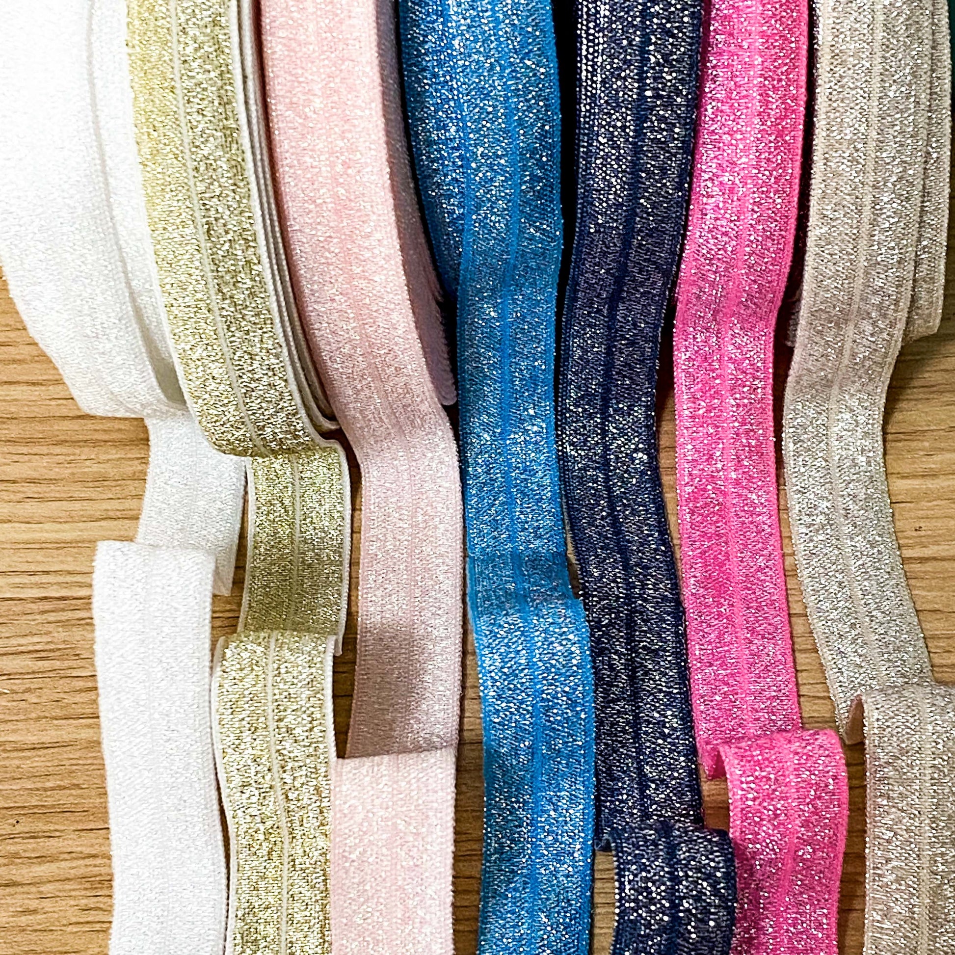 fold over elastic elastics ribbon ribbons glitter glittery foil foiled sparkly pretty craft supplies shop store crafts yard pink blue navy lilac gold silver white peach black pink  Edit alt text