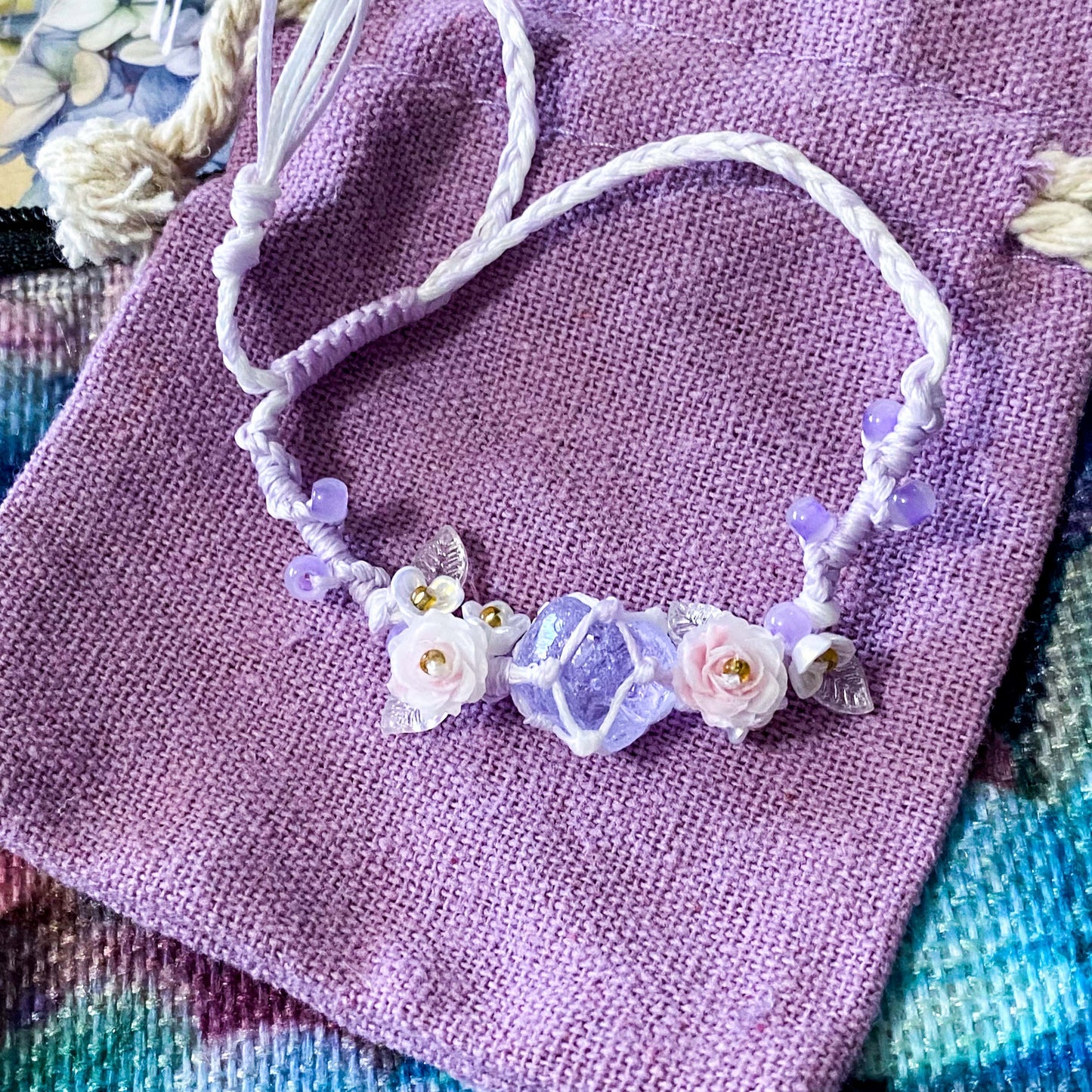 hydrangea whispers midi letterbox gift set with a textured hydrangea pouch, floral ballpoint pen, blank greetings card with kraft envelope, two hydrangeas postcards and an adjustable crystal floral bracelet in a lilac drawstring bag. uk gifts shop.