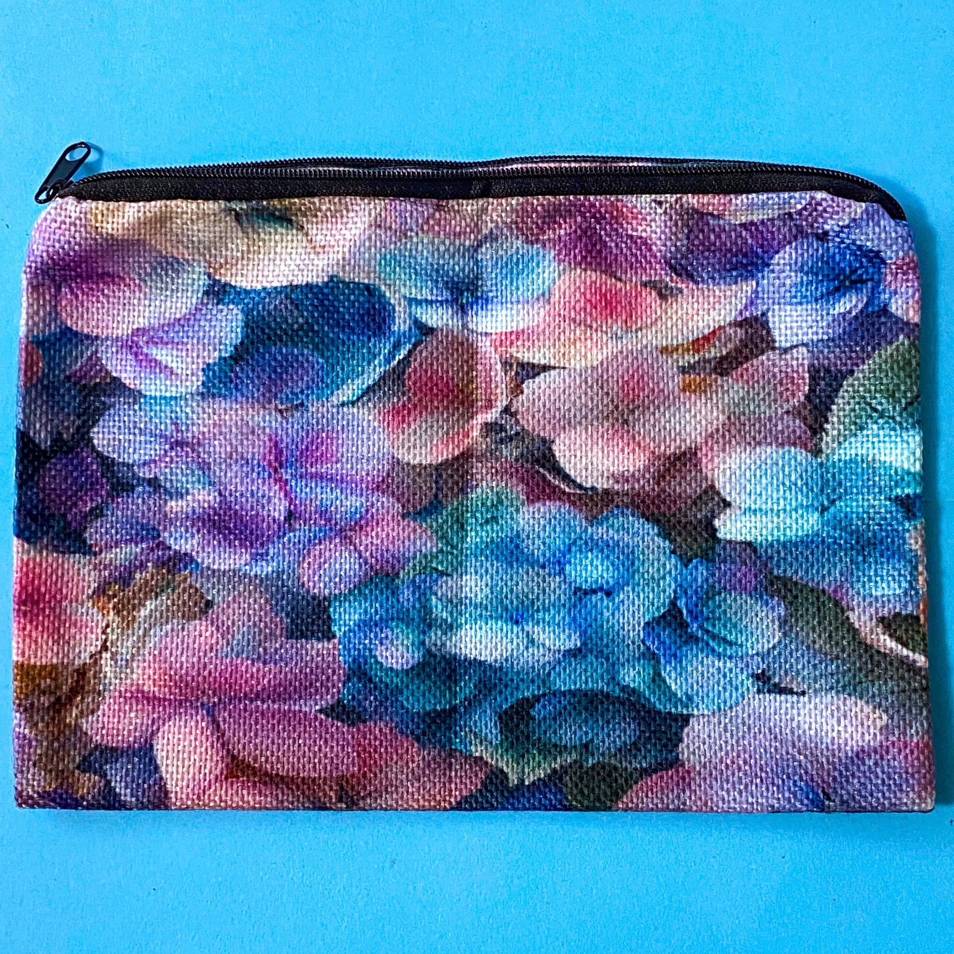 hydrangea whispers midi letterbox gift set with a textured hydrangea pouch, floral ballpoint pen, blank greetings card with kraft envelope, two hydrangeas postcards and an adjustable crystal floral bracelet in a lilac drawstring bag. uk gifts shop.
