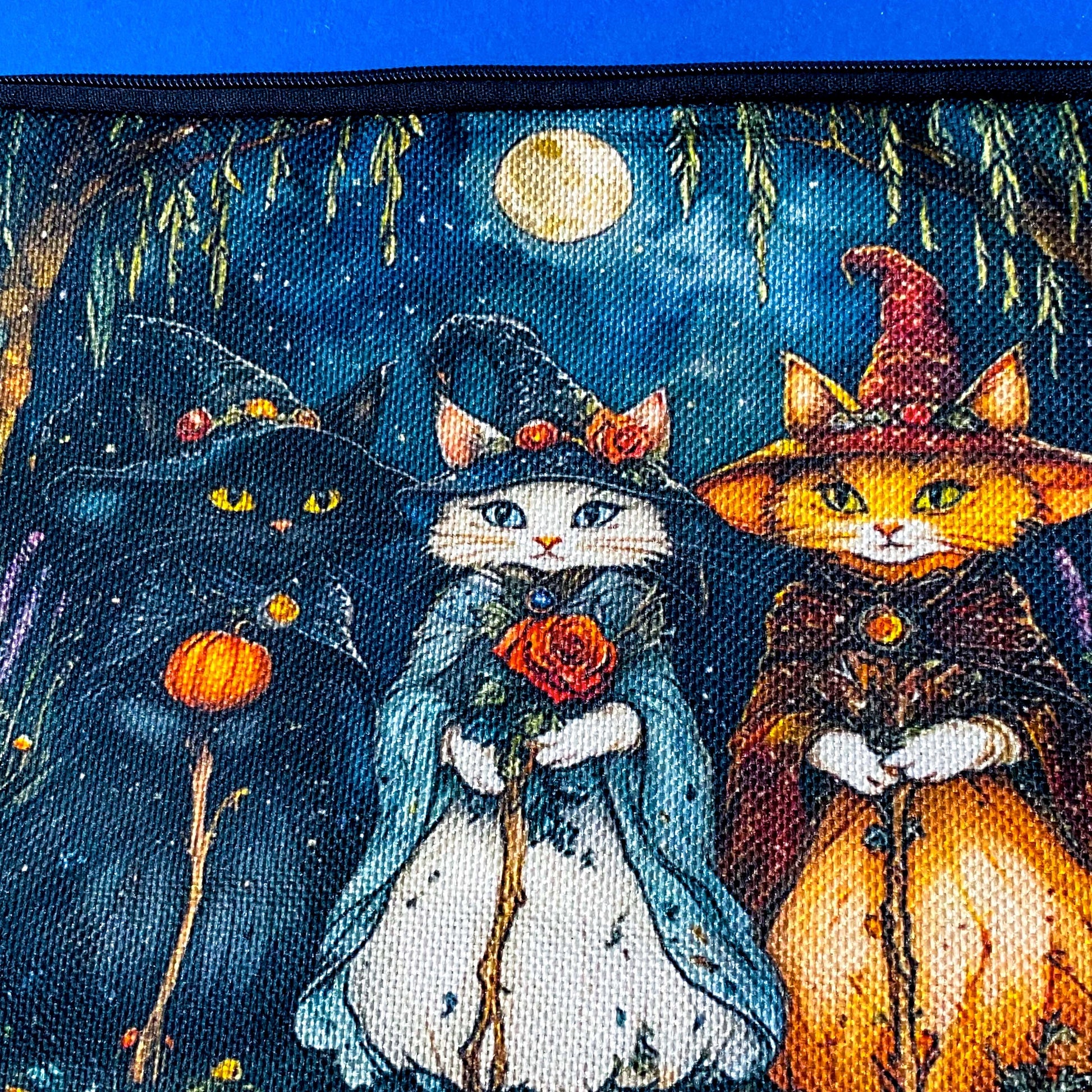 textured canvas pouch featuring three witch cats gathering beneath a full moon in an enchanted woodland with willow branches, mushrooms and autumn leaves. Dark blue, green, storm grey and black. Uk letterbox gifts. Halloween theme.