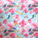 pink meadow flowers (cosmos) on a pale blue backgound tissue paper sheet