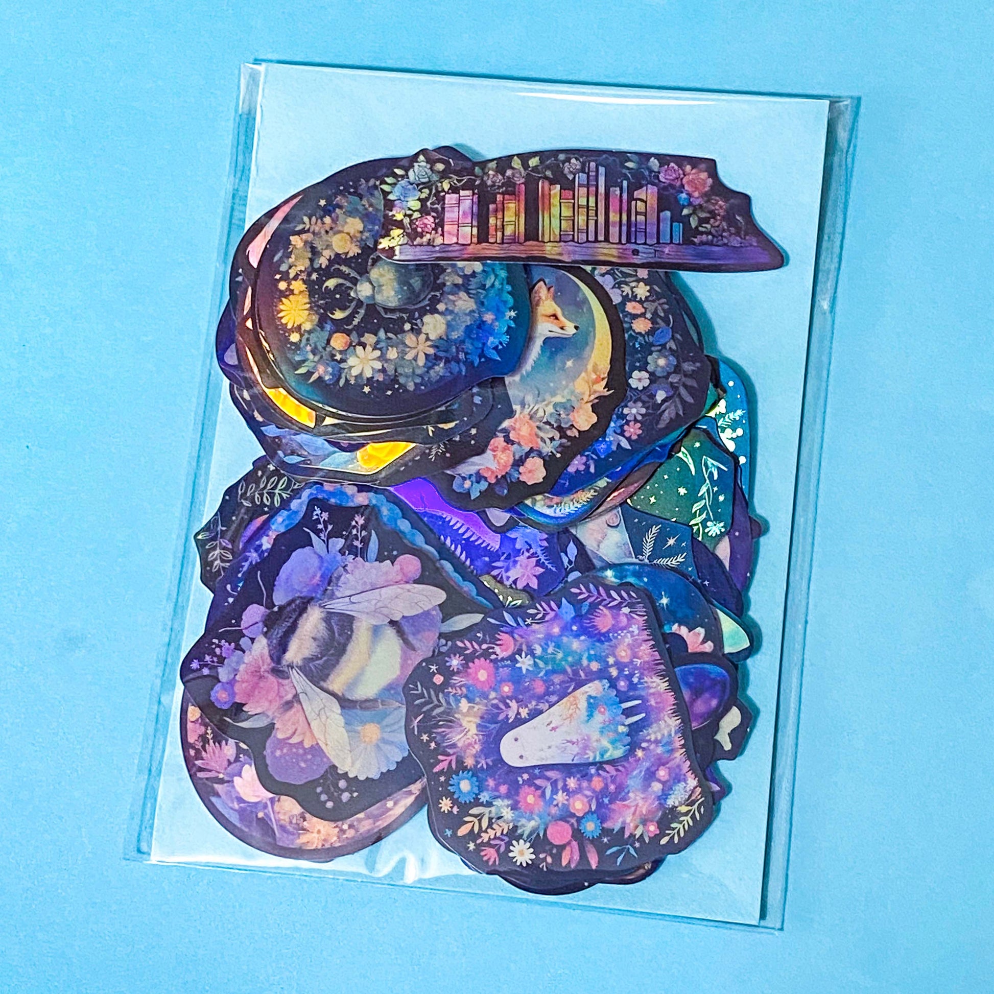 dark holo laptop stickers set of 50 with a witchy woodland theme on a blue background