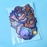 dark holographic laptop stickers with a magical woodland theme on a blue background