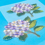 iron on lilac and white hydrangea flower applique patches on a blue background