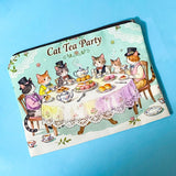 Pouch with cat-themed tea party design on a blue background