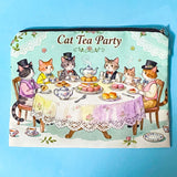 make up Pouch or pencil case with illustration of cats at a tea party on a blue background