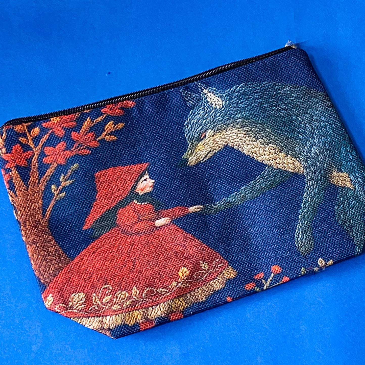 canvas pouch with vintage illustration of little red riding hood and the wolf in the forest