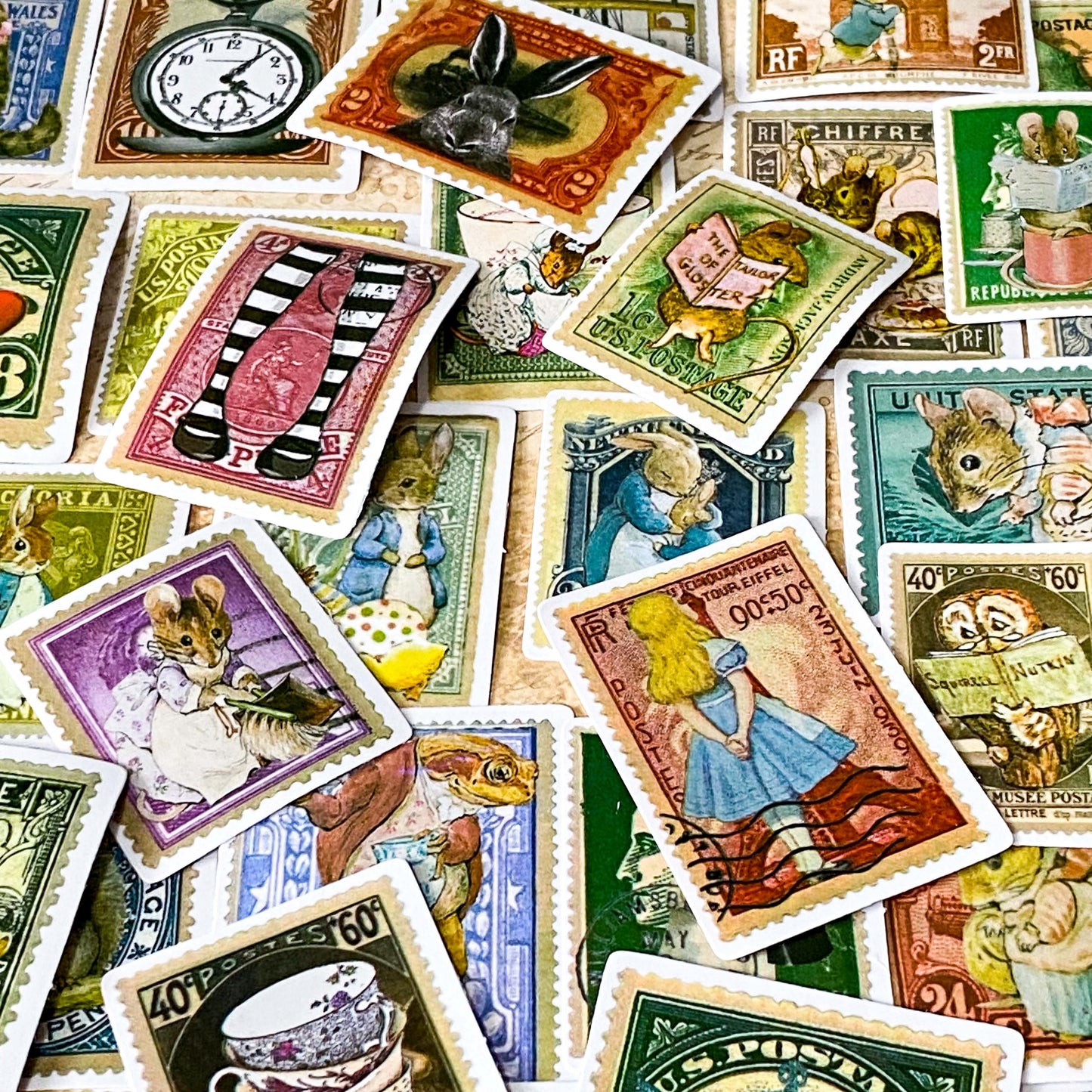 alice in wonderland vintage stamp stickers including teacups, the white rabbit, cheshire cat and pocket watch