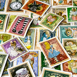alice in wonderland vintage stamp stickers including teacups, the white rabbit, cheshire cat and pocket watch