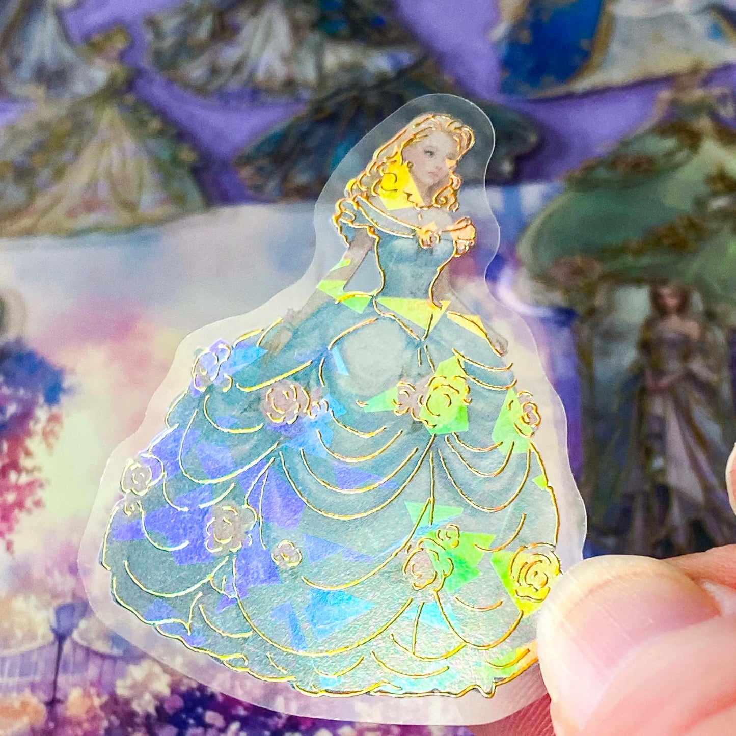 pack of 30 holographic princess stickers with gold foil outlines featuring elegant dancing princesses, castle scenes and fantasy ball gowns on transparent pet plastic clear material. uk cute stationery shop. storybook sticker set.