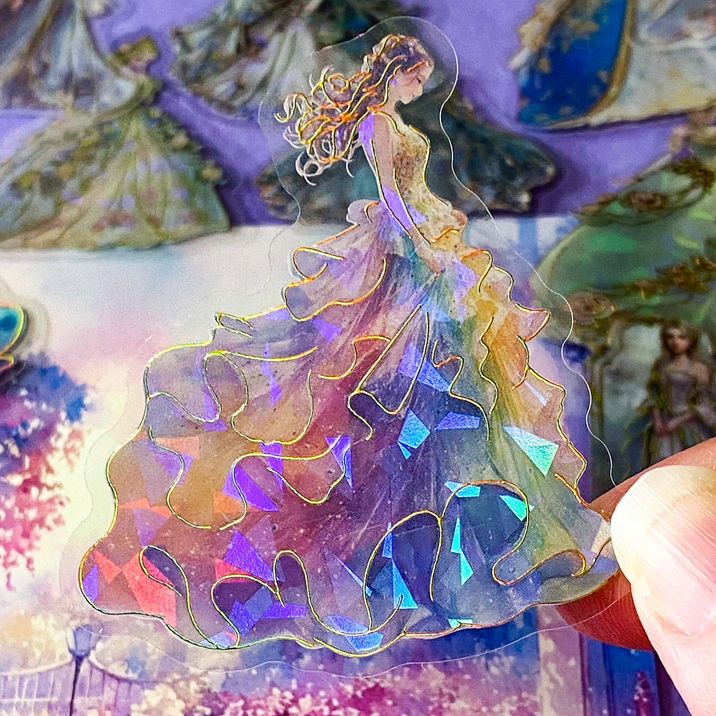 pack of 30 holographic princess stickers with gold foil outlines featuring elegant dancing princesses, castle scenes and fantasy ball gowns on transparent pet plastic clear material. uk cute stationery shop. storybook sticker set.