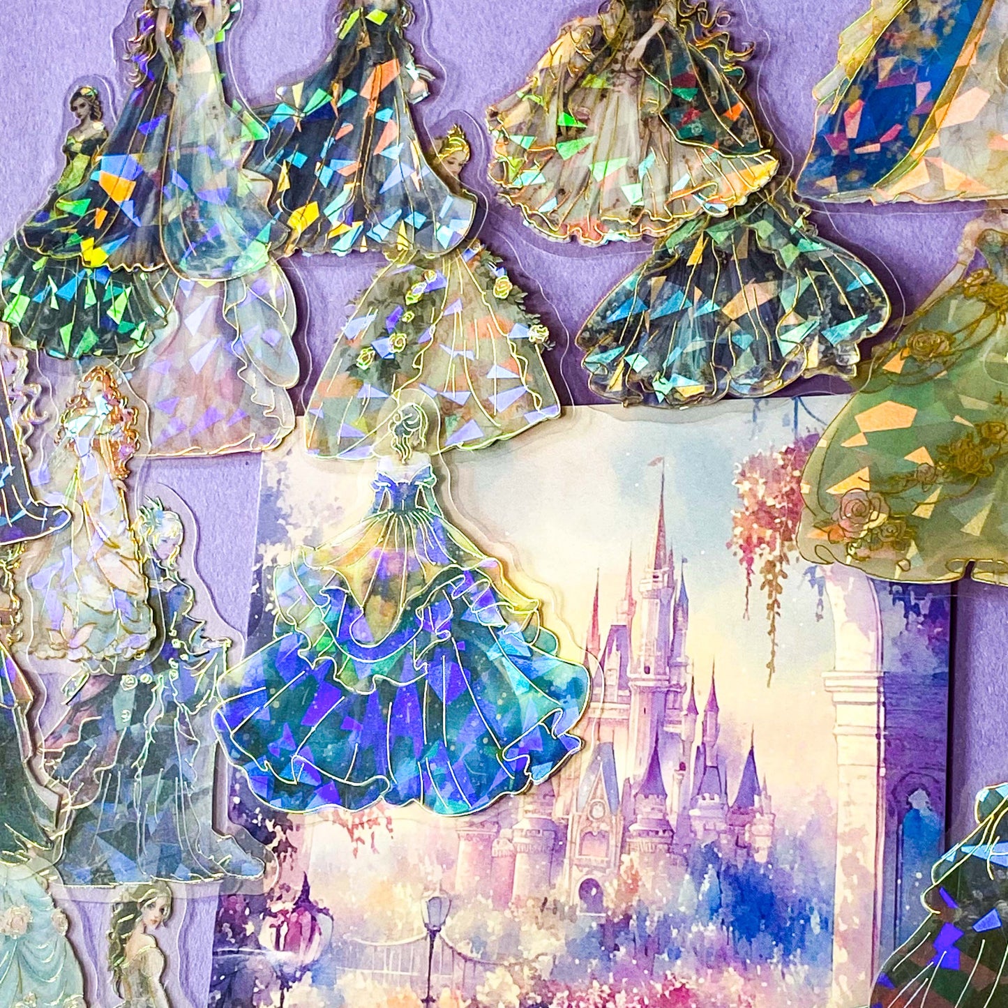 pack of 30 holographic princess stickers with gold foil outlines featuring elegant dancing princesses, castle scenes and fantasy ball gowns on transparent pet plastic clear material. uk cute stationery shop. storybook sticker set.