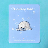 iron on applique embroidered patch of a cute seal on a blue background