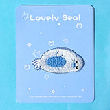 iron on applique embroidered patch of a cute seal on a blue background