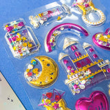 very large pack of 3d shaker puffy clear stickers with moving sequins and bright pink magical motifs