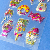 very large pack of 3d shaker puffy clear stickers with moving sequins and bright pink magical motifs