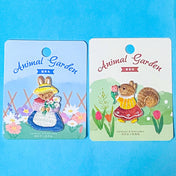 storybook cute woodland embroidered iron on fabric appliques of rabbit and squirrel on a blue background