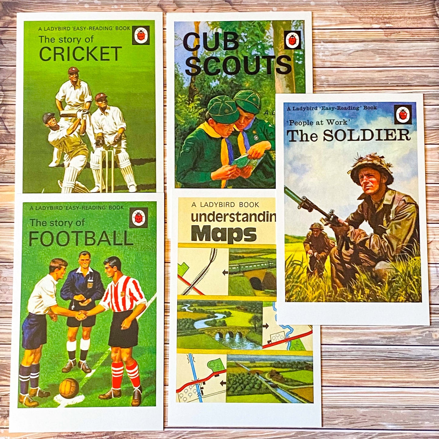 vintage ladybird book covers postcards set featuring the soldier, maps, football, cricket and cub scouts