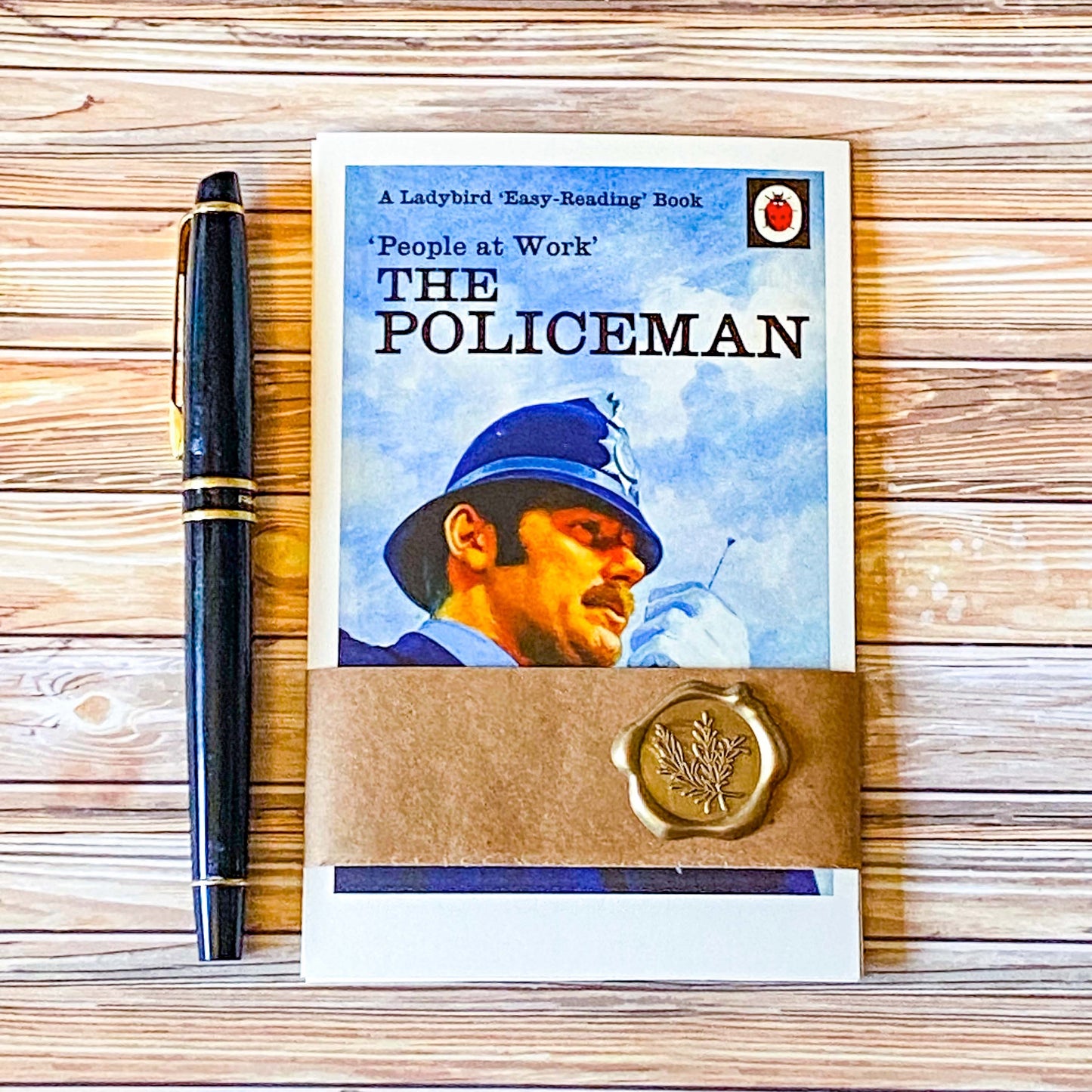 nostalgic ladybird book cover postcard set people at work with the policeman wrapped in a kraft belly band with a vintage wax seal sticker