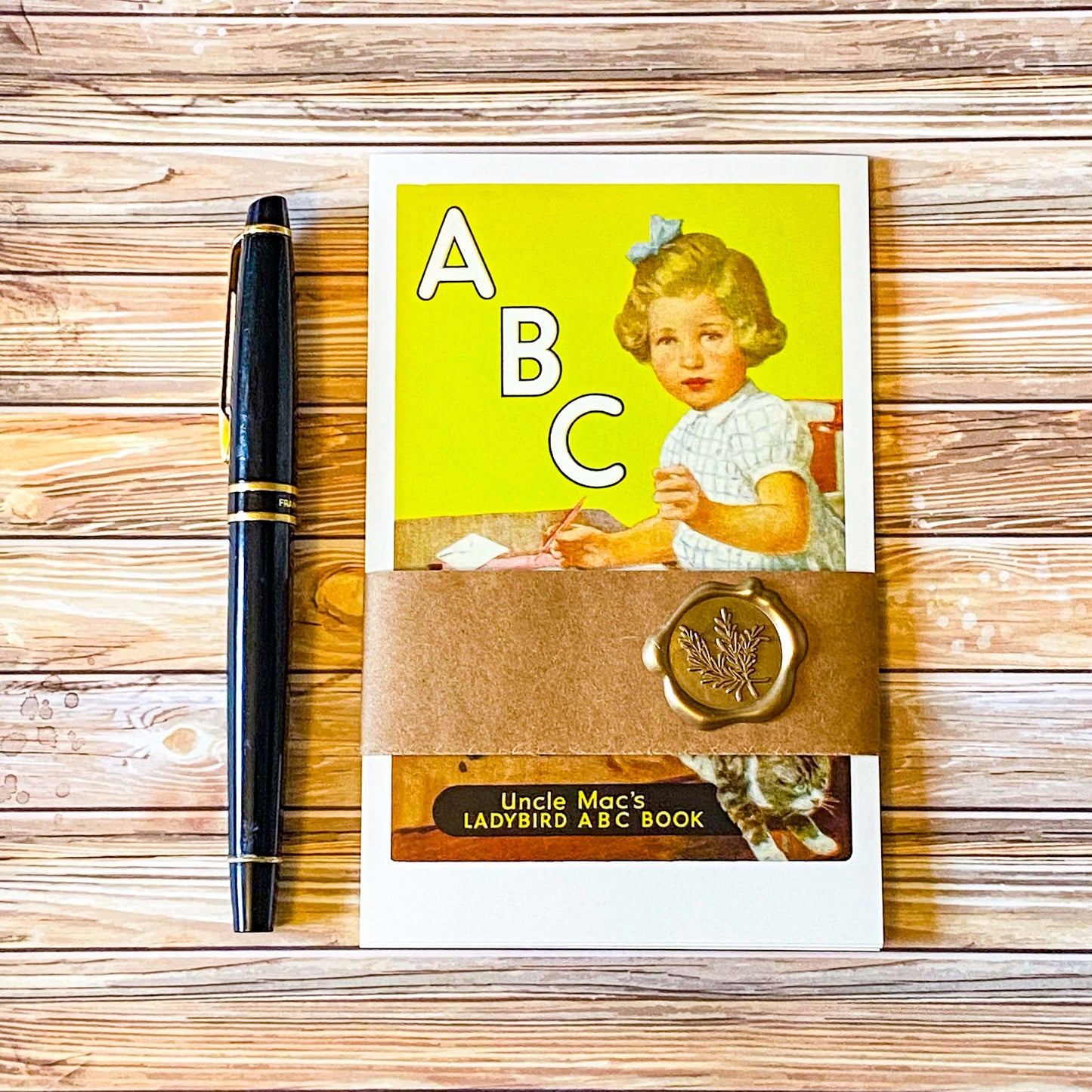vintage set of 5 ladybird book cover retro postcards with a kraft belly band and wax seal sticker with a fountain pen 