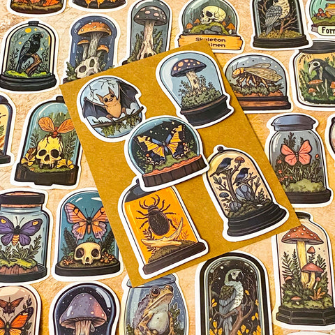 curiosity cabinet specimen dome stickers with butterflies, mushrooms, birds and skulls vintage natural history style laptop sticker set