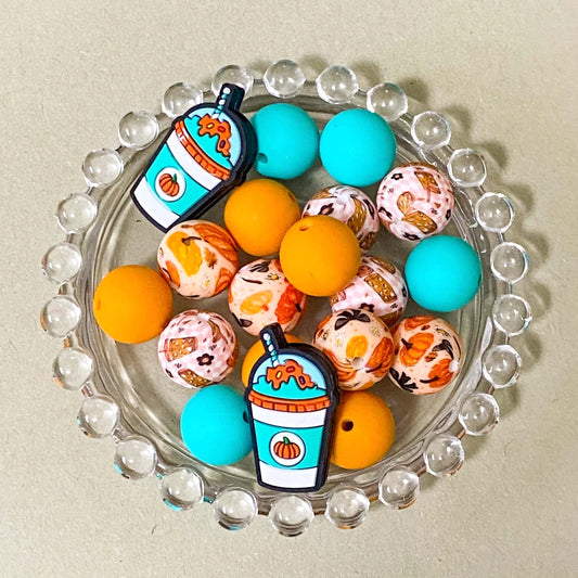 cosy autumn silicone bead bundle with bright teal green, mustard orange round beads and patterned pumpkin and cute drink beads with kawaii drink cup jumbo topper beads. uk craft supplies for making beaded pens.