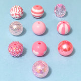 Assorted pink beads on a light blue background