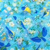 colourful blue tits apple blossom and daffodils tissue paper on a pale blue background