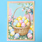 Decorative postcard with a basket of colourful Easter eggs and flowers on a blue background