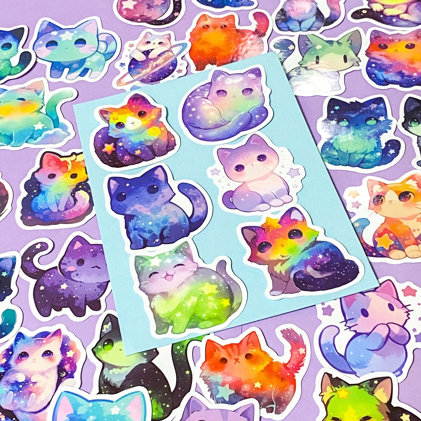 Colorful cat-themed stickers on a purple background