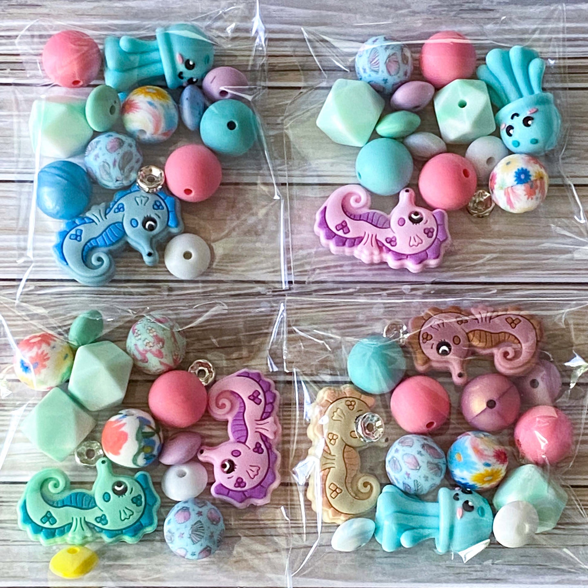ocean silicone beads set of 15 with seahorse and octopus focal beads and round and multi sided aqua, teal, turquoise, pink and blue beads to make a beaded pen