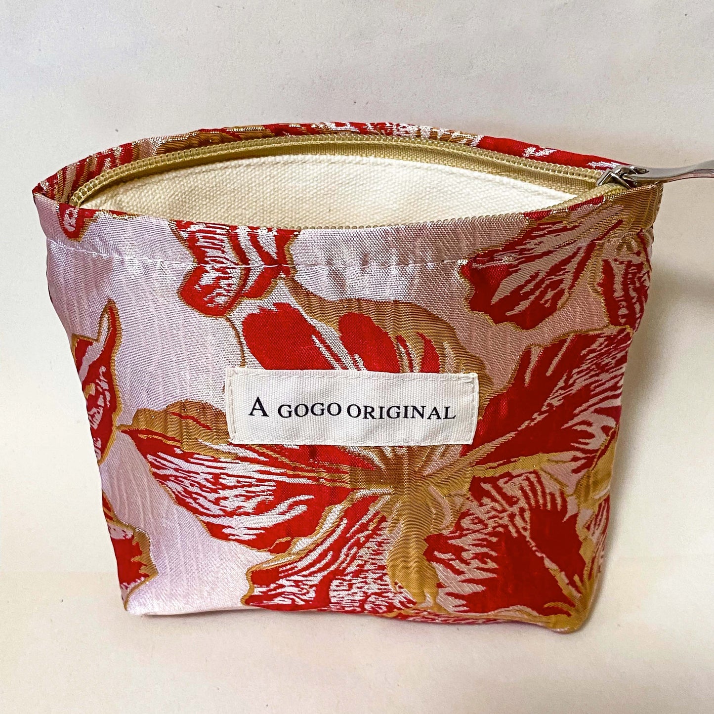 rose gold and crimson small floral bucket shaped lined satin fabric pouch for cosmetics or stationery. Metallic rich red and gold premium petite bag. Uk letterbox gifts.