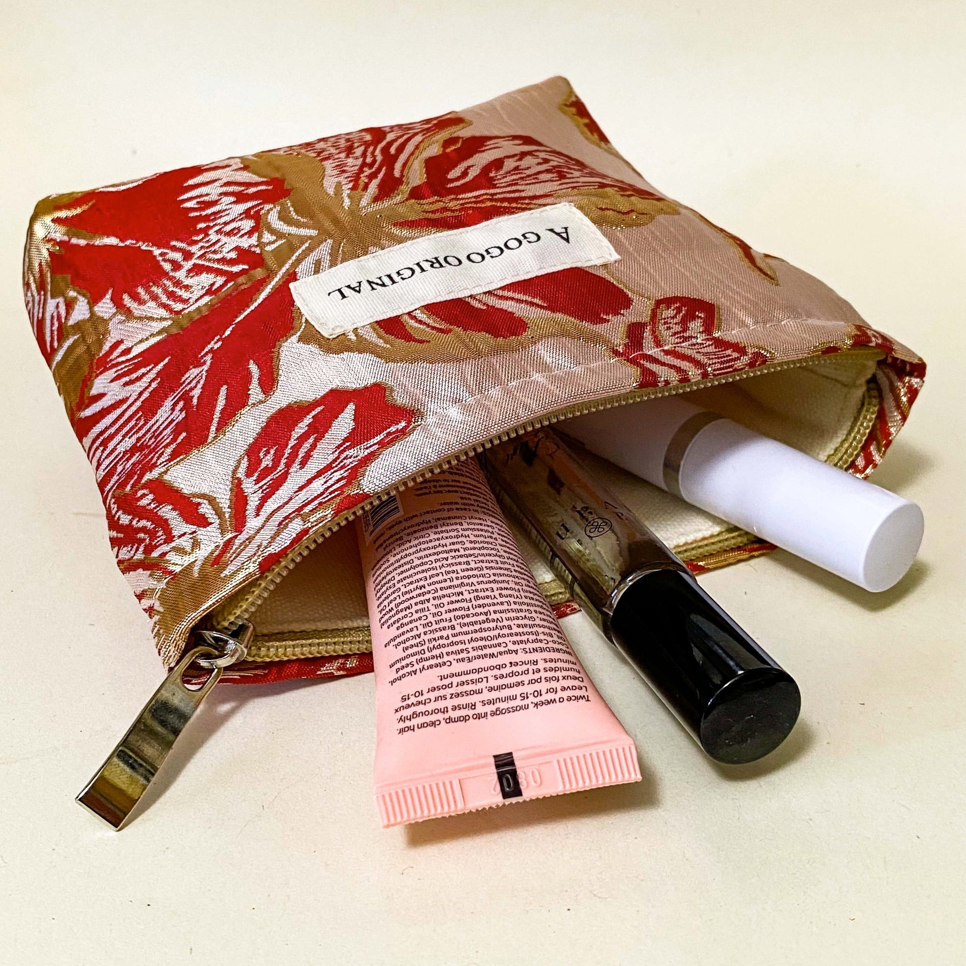 rose gold and crimson small floral bucket shaped lined satin fabric pouch for cosmetics or stationery. Metallic rich red and gold premium petite bag. Uk letterbox gifts.