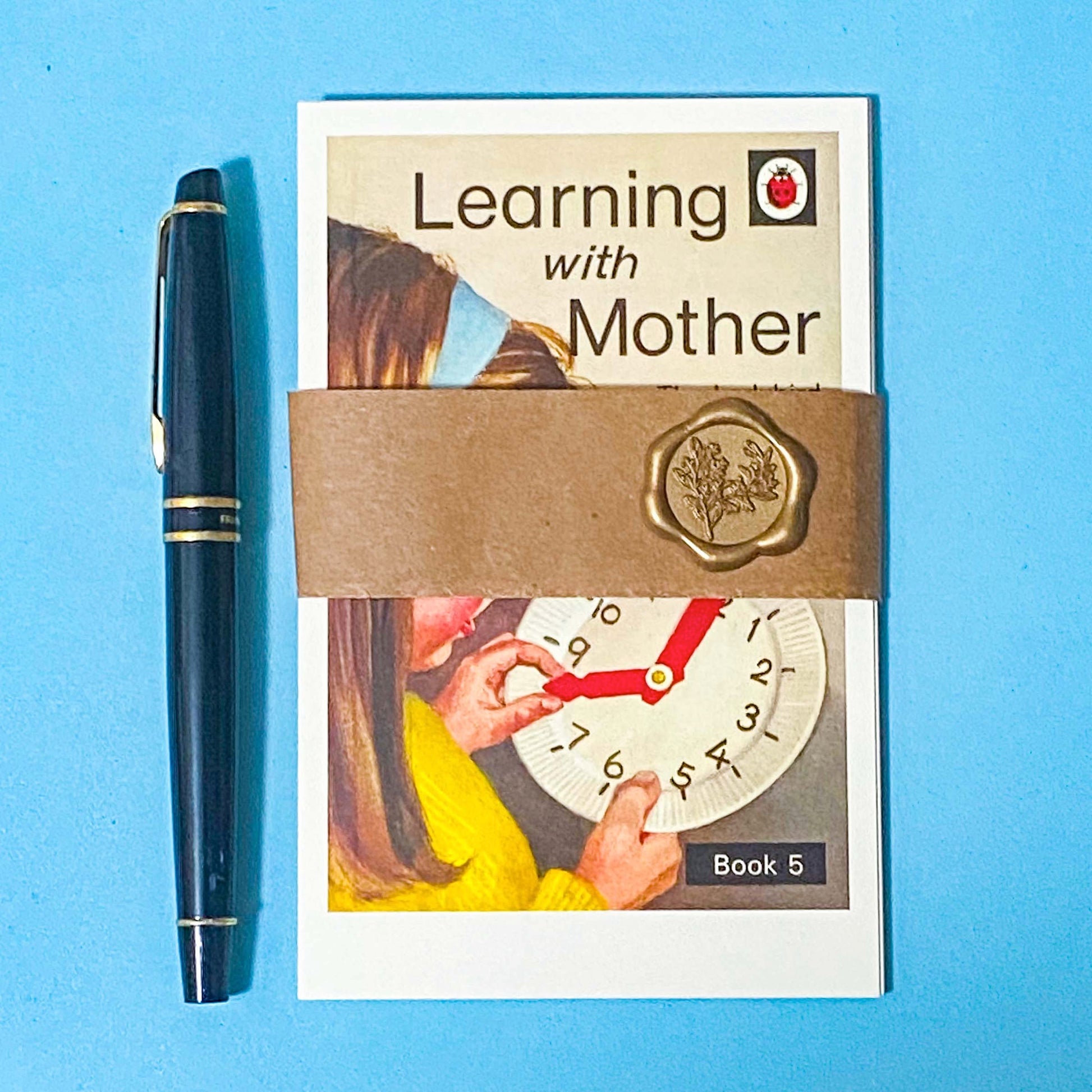 set of 5 vintage ladybird book cover illustrations with a kraft belly band and wax seal. learning with mother