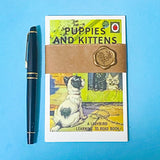 vintage ladybird book cover postcards animals and pets set wrapped with a kraft belly band and a wax seal on blue background
