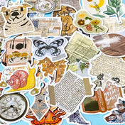 vintage laptop sticker set with camera, violin, dog, newspapers, letters, flowers and moths