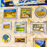 Collection of 3D stereoscopic stickers with Van Gogh artwork on a textured surface.