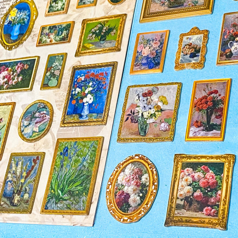 Collection of framed paintings of flowers stickers on a blue and beige background